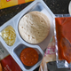 Pizza Lunchables container, opened to show bread, cheese, sauce, and pepperoni